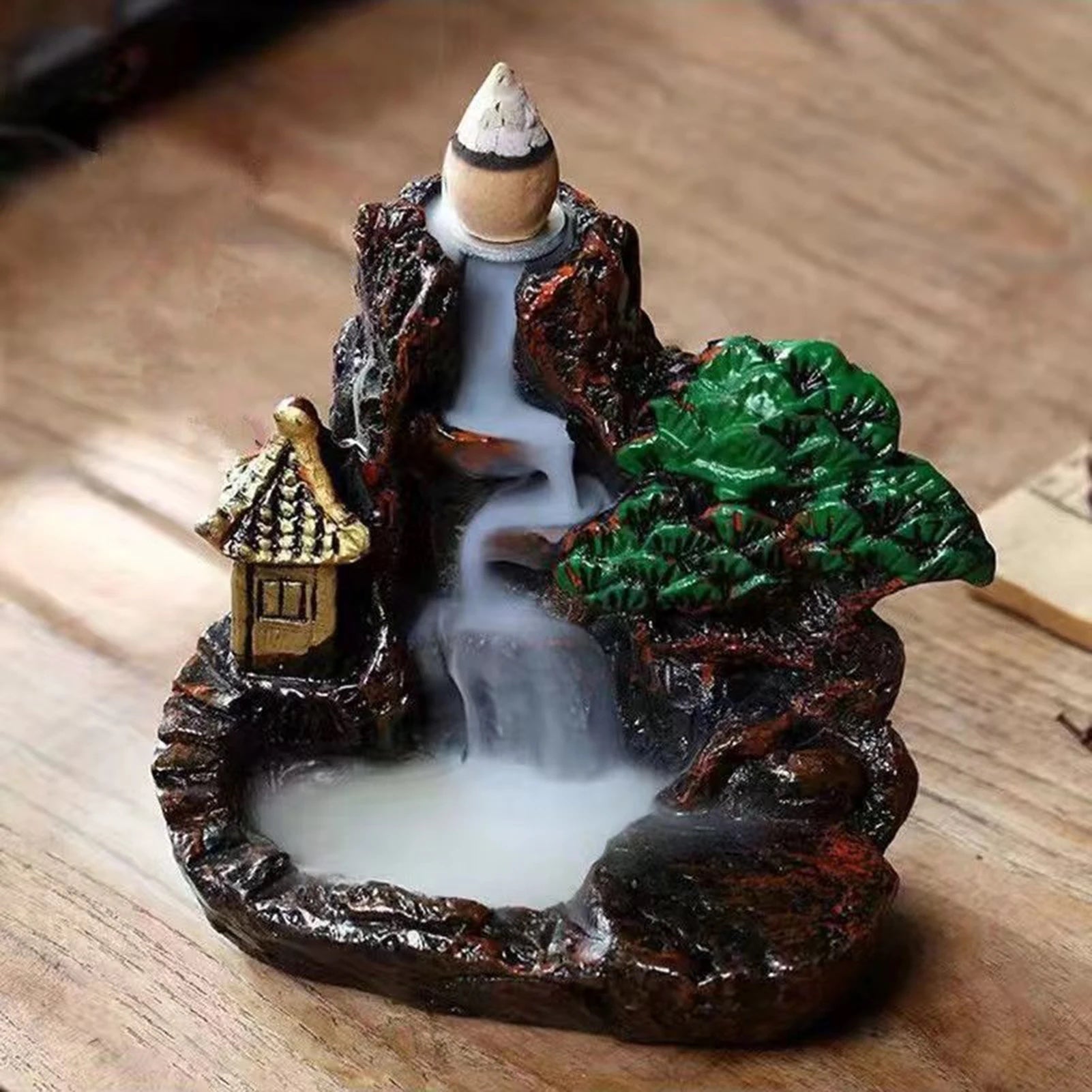 the mountain burner with smoke falling down the cliff into the basin