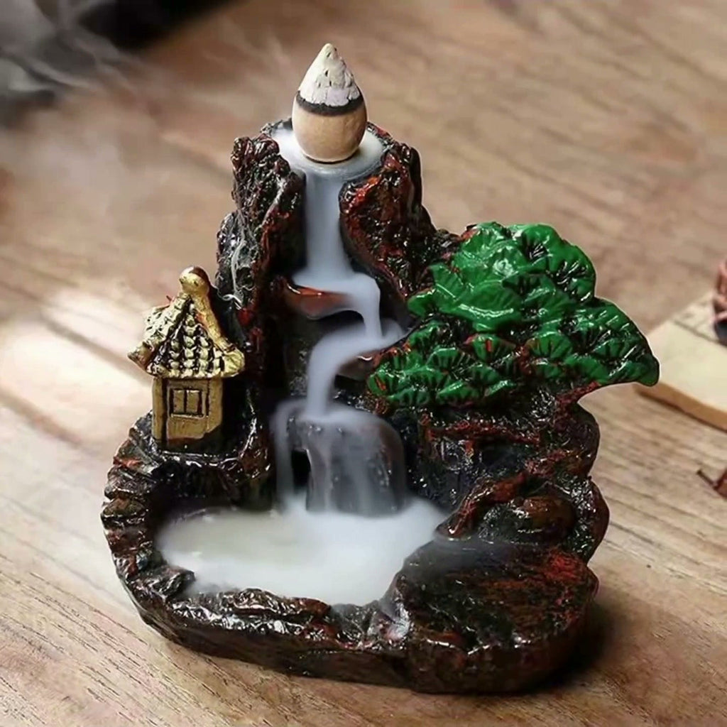 the mountain burner backflow incense burner with smoke cascade, wood table