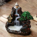 the mountain burner backflow incense burner with smoke cascade, wood table